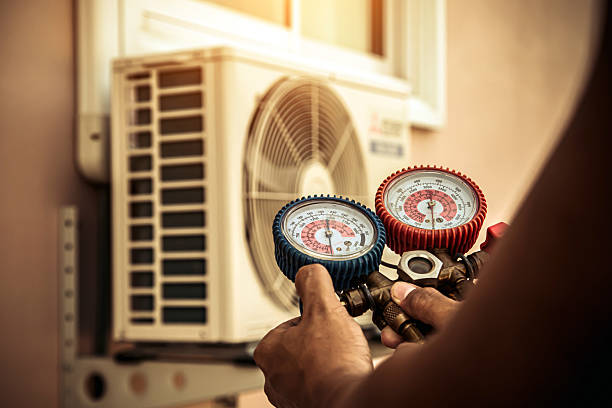 Professional Air Conditioning Service technician working in Maplewood, WA